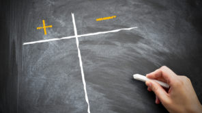 Pro's and con's graph on a blackboard with a person holding chalk