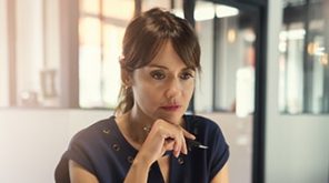 Women with pen in her hand thinking